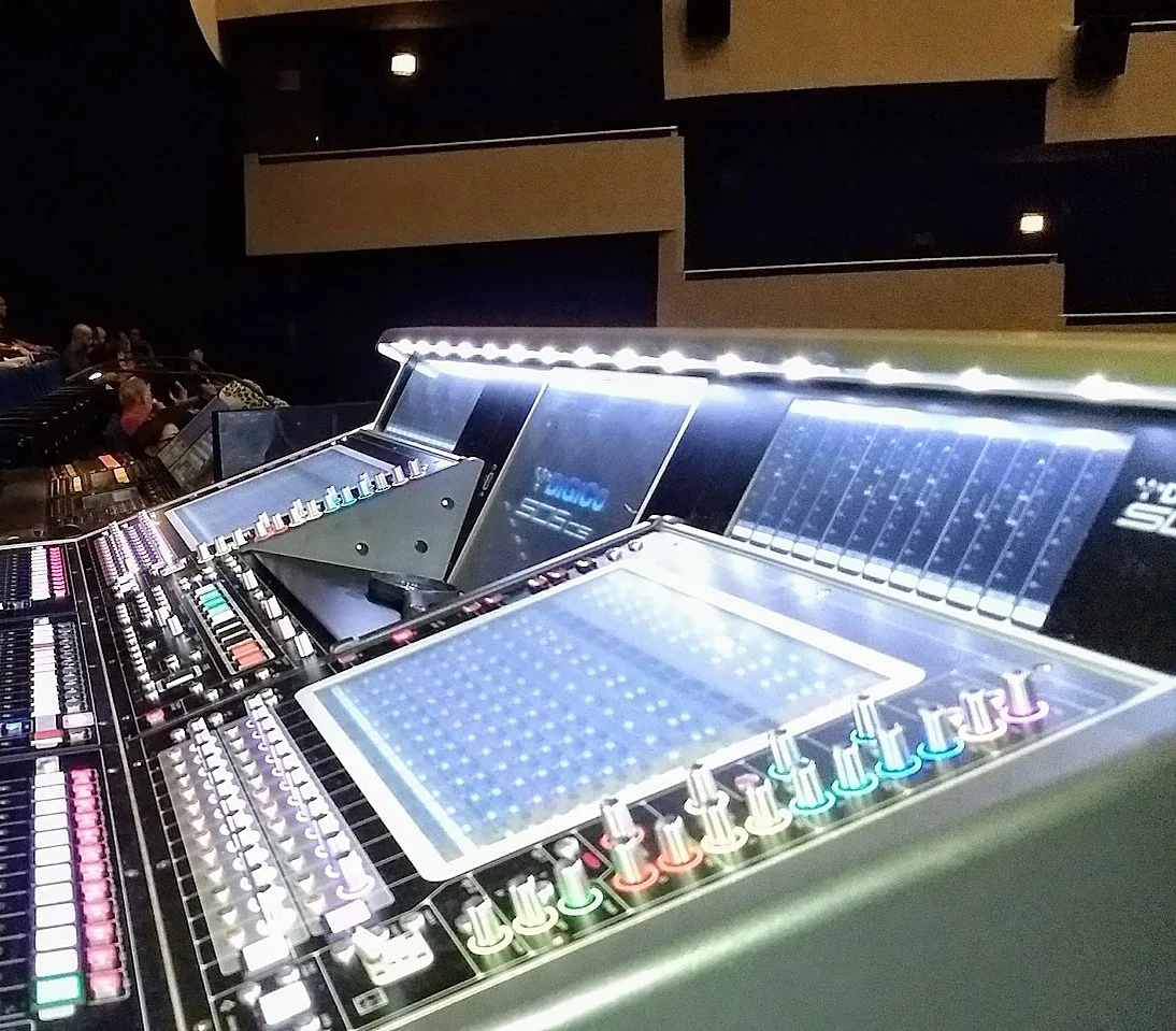 Close-up of a lit DiGiCo mixing console in a theater